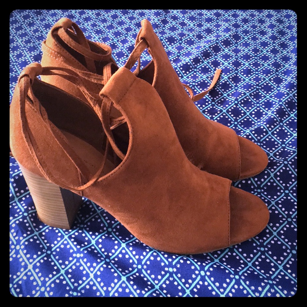 Size 8 open toed lace up sandals.